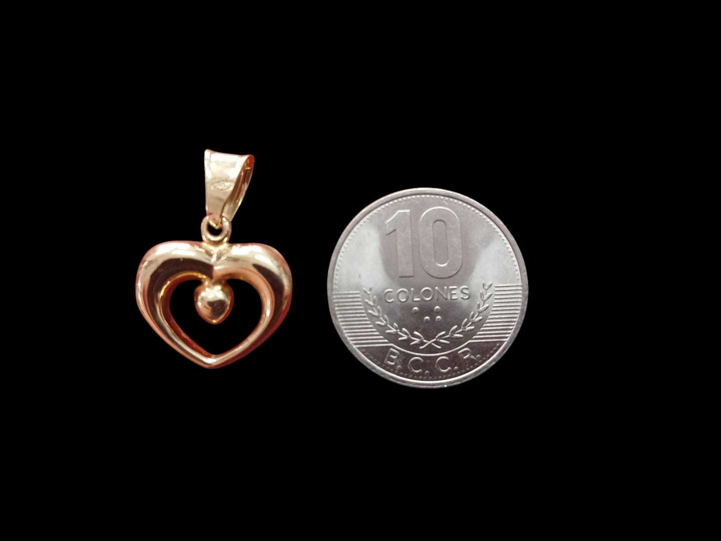 Precio 49 000,00   Dije doble corazon