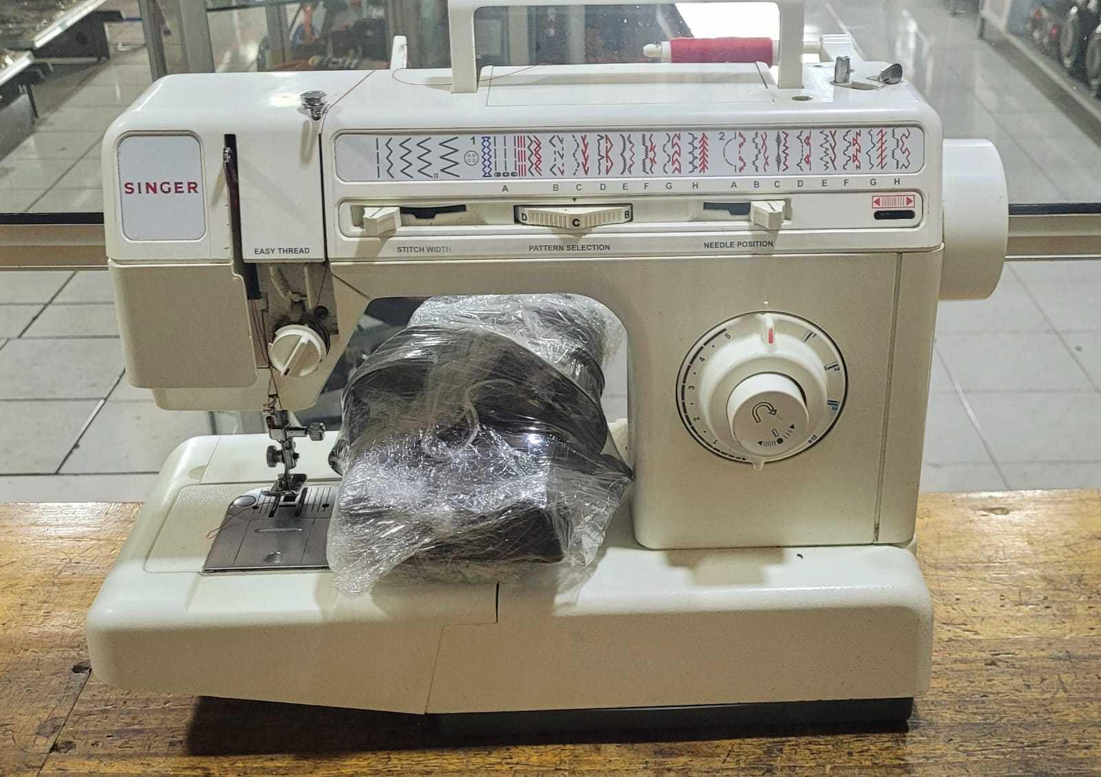 Precio 65 000,00 singer  Maquina de coser