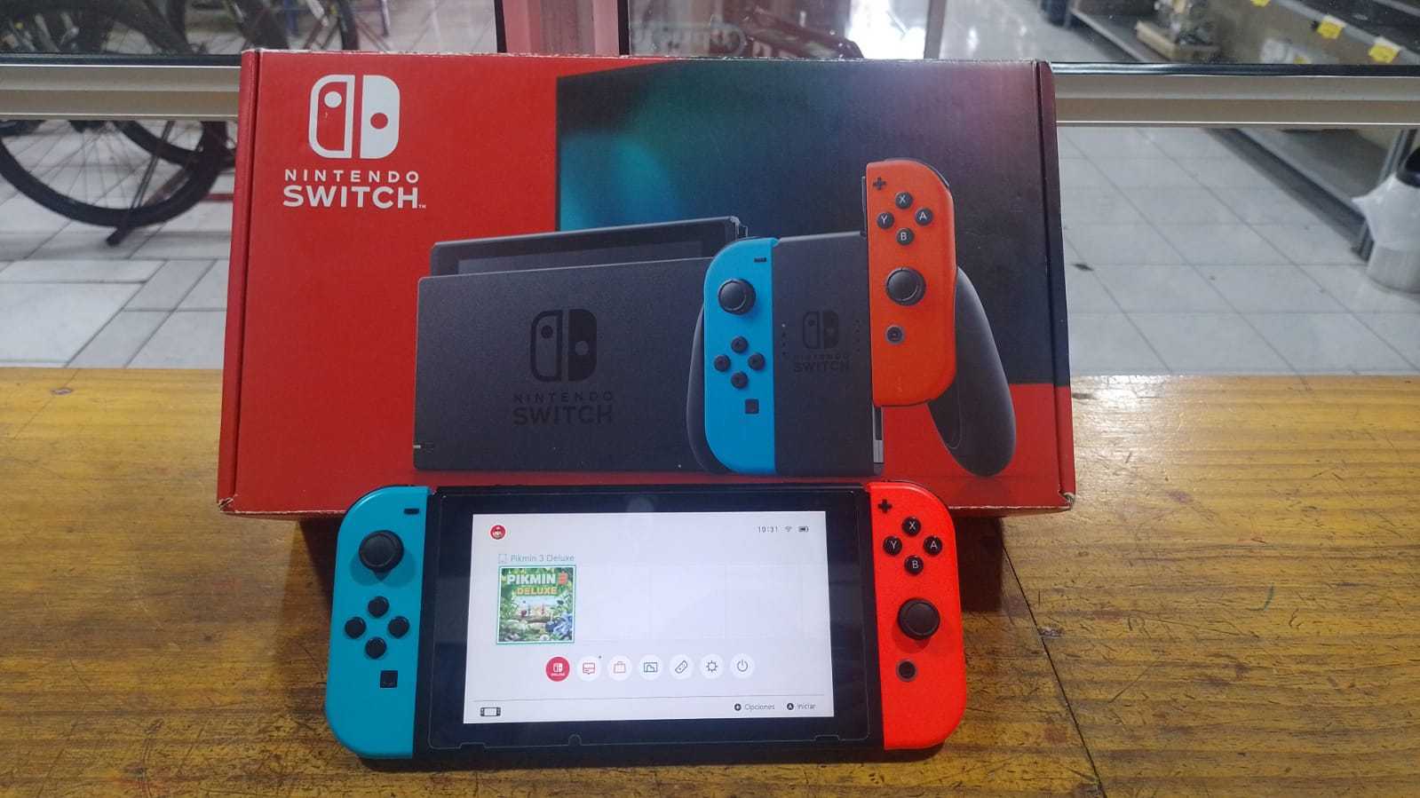 Precio 90 000,00 nintendo switch v1 Consola con sus  accesorios en caja