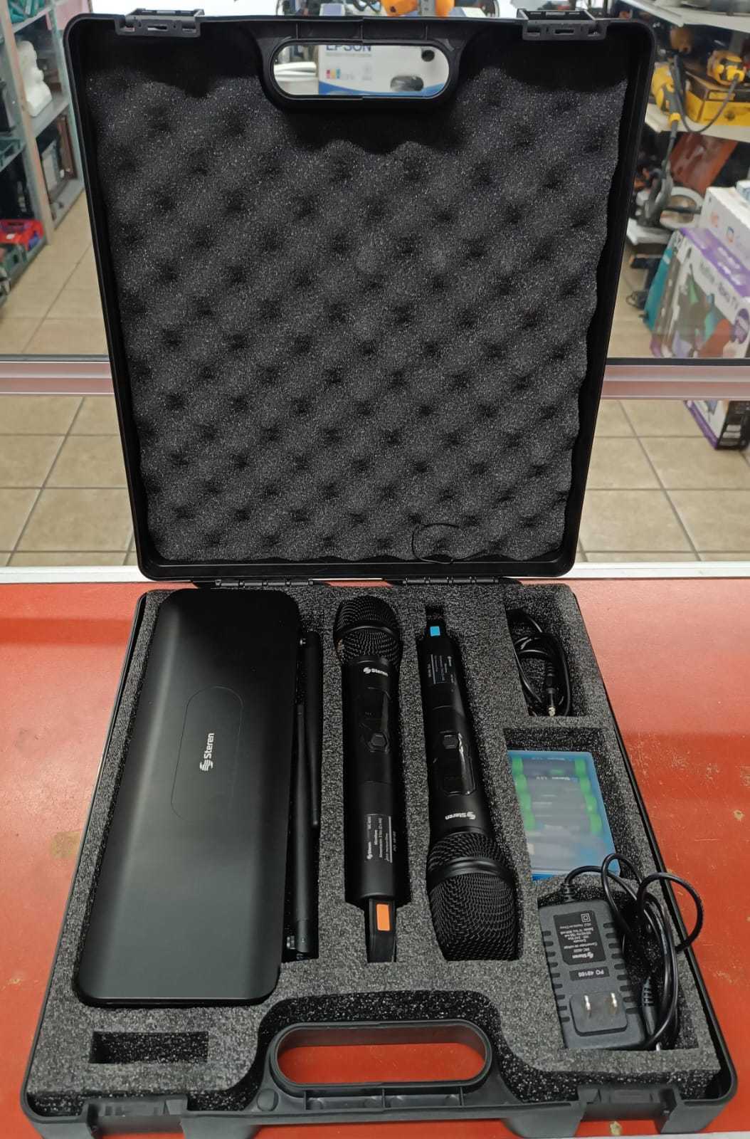 Precio 80 000,00 Steren ND Juego de dos microfonos con sus baterias, cable de carga y receptor Steren en maleta